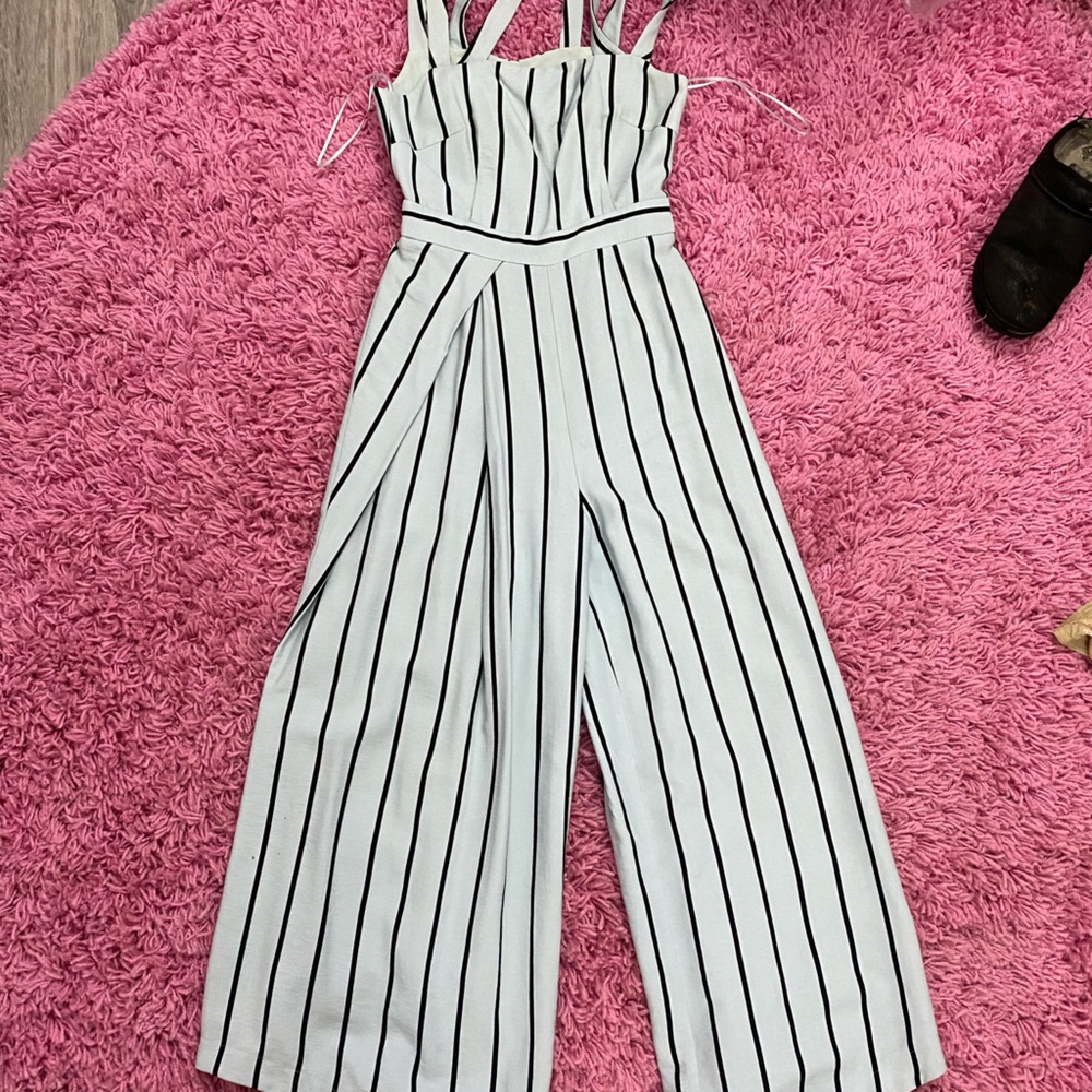 Adorable, pinstripe jumpsuit with strappy detail